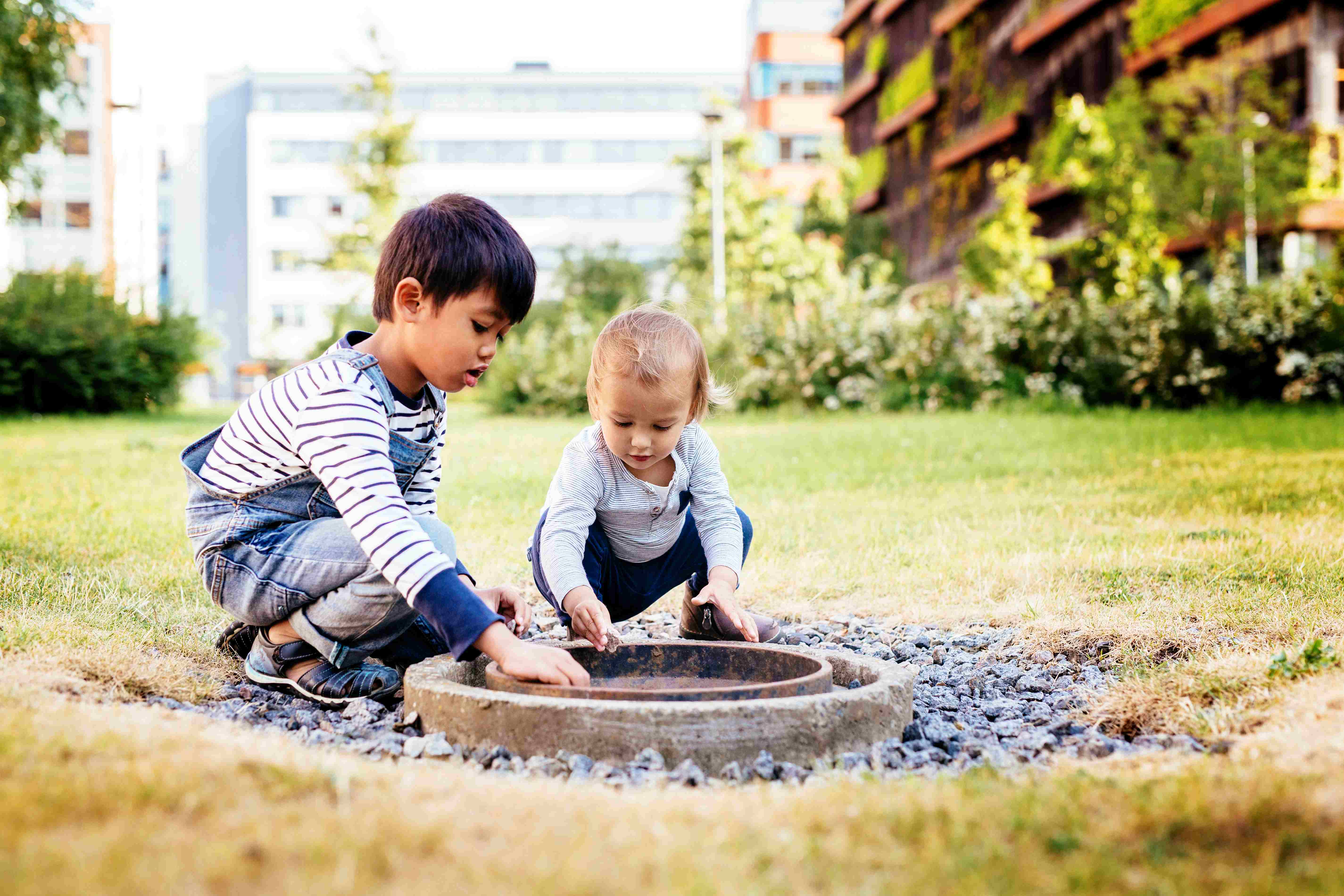 kids playing together and discovering new things outside