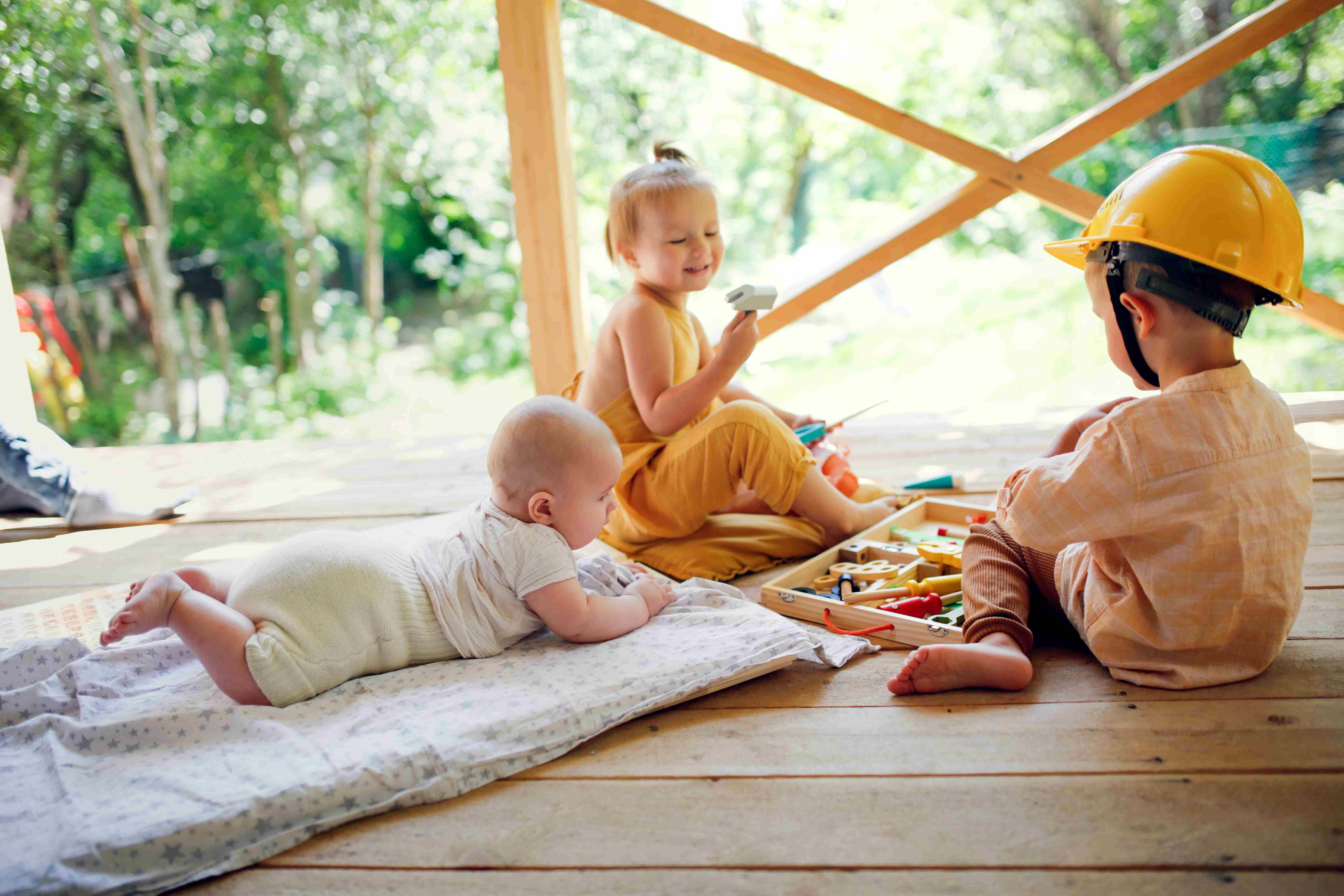kids playing together outside on a porch